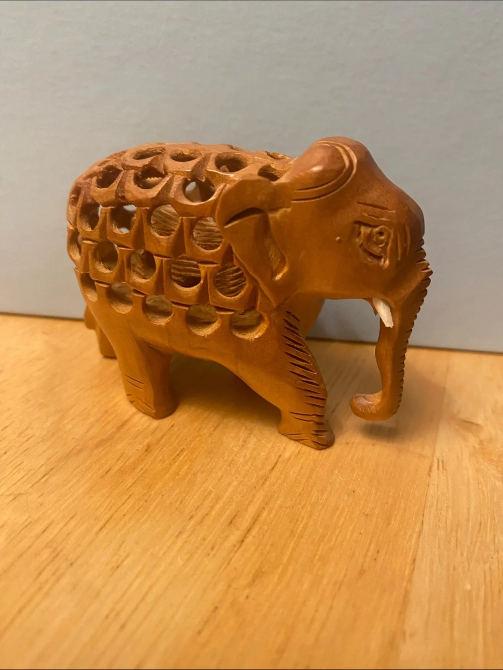 Hand-Carved Wooden Elephant Figurine in Warm Brown with baby elephant in stomach